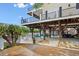 Spacious under deck area featuring outdoor seating, swings, and access to the canal at 6001-308 South Kings Hwy., Myrtle Beach, SC 29575