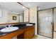 Double vanity bathroom with a walk-in shower and elegant fixtures at 603 S Ocean Blvd. # 1205, North Myrtle Beach, SC 29582