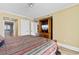 Cozy bedroom with ocean view visible on TV and en suite bathroom at 603 S Ocean Blvd. # 1205, North Myrtle Beach, SC 29582