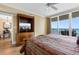 Comfortable bedroom featuring a TV, balcony access, and beautiful ocean views at 603 S Ocean Blvd. # 1205, North Myrtle Beach, SC 29582