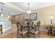 Cozy dining area features a decorative table and chairs, illuminated by a modern pendant light at 603 S Ocean Blvd. # 1205, North Myrtle Beach, SC 29582