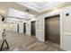 Well-maintained hallway to elevators, tiled floors and attractive lighting at 603 S Ocean Blvd. # 1205, North Myrtle Beach, SC 29582