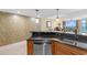 Modern kitchen with stainless steel dishwasher, granite countertops and pendant lighting at 603 S Ocean Blvd. # 1205, North Myrtle Beach, SC 29582