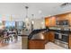 Open concept kitchen with granite countertops and stainless steel appliances, overlooks dining and living areas at 603 S Ocean Blvd. # 1205, North Myrtle Beach, SC 29582