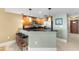 This kitchen bar features ample counter space and seating for three at 603 S Ocean Blvd. # 1205, North Myrtle Beach, SC 29582