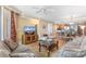 Spacious living area with a large TV, comfortable seating, and an open view of the kitchen and dining area at 603 S Ocean Blvd. # 1205, North Myrtle Beach, SC 29582