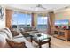 Inviting living room with plush sofas, ocean views, and a stylish glass coffee table at 603 S Ocean Blvd. # 1205, North Myrtle Beach, SC 29582