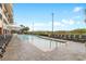 Outdoor pool area with plenty of lounge chairs and ocean views at 603 S Ocean Blvd. # 1205, North Myrtle Beach, SC 29582