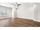 Bright and airy bedroom featuring hardwood floors and a large window offering natural light at 605 Carter Reid Ct., Longs, SC 29568