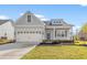 Charming single-Gathering home features a two-car garage, well-maintained lawn, and appealing architectural details at 605 Carter Reid Ct., Longs, SC 29568