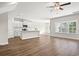 Spacious living area with hardwood floors, and an open layout connected to the kitchen area at 605 Carter Reid Ct., Longs, SC 29568