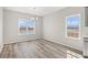 Dining room with neutral walls, wood-look flooring, and a window overlooking the water at 609 Carter Reid Ct., Longs, SC 29568
