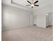Spacious main bedroom featuring plush carpeting, ample natural light, and ensuite bath access at 609 Carter Reid Ct., Longs, SC 29568