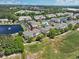 Picturesque aerial view of a community with lakes, a pool, and a golf course at 6203 Catalina Dr. # 1832, North Myrtle Beach, SC 29582