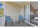 Balcony featuring outdoor seating and a peek inside to the living room at 6203 Catalina Dr. # 1832, North Myrtle Beach, SC 29582
