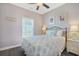 Cozy bedroom with queen bed, bright decor, and a large window at 6203 Catalina Dr. # 1832, North Myrtle Beach, SC 29582
