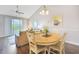 Dining room with vaulted ceilings open to the living area and kitchen at 6203 Catalina Dr. # 1832, North Myrtle Beach, SC 29582