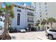 Coastal condo exterior featuring private balconies, convenient parking, and vibrant palm trees at 6203 Catalina Dr. # 1832, North Myrtle Beach, SC 29582