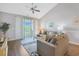 Inviting living room with access to balcony offers views of lush greenery at 6203 Catalina Dr. # 1832, North Myrtle Beach, SC 29582
