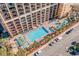 Aerial view of resort featuring multiple pools, splash pad, and ample parking at 6900 N Ocean Blvd. # 208, Myrtle Beach, SC 29572