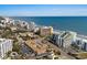 Aerial view of the beachside buildings with the ocean in the background at 6900 N Ocean Blvd. # 208, Myrtle Beach, SC 29572