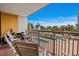 Balcony view overlooking a pool and the beach with distant trees at 6900 N Ocean Blvd. # 208, Myrtle Beach, SC 29572
