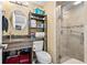 Cozy bathroom featuring tile shower, updated vanity, and convenient storage shelves at 6900 N Ocean Blvd. # 208, Myrtle Beach, SC 29572