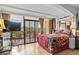Cozy bedroom featuring a comfortable bed and sliding glass doors that open to a patio at 6900 N Ocean Blvd. # 208, Myrtle Beach, SC 29572