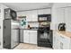 Efficient kitchen, includes modern appliances, white cabinets, and stylish black hardware at 6900 N Ocean Blvd. # 208, Myrtle Beach, SC 29572
