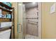 Well-lit shower area featuring tiled walls, glass door, and shower head at 6900 N Ocean Blvd. # 208, Myrtle Beach, SC 29572