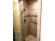 Tiled shower stall with glass doors, hand shower, and grab bar at 6900 N Ocean Blvd. # 208, Myrtle Beach, SC 29572
