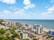 A wide aerial view of hotels and resorts near the beach with cars parked around town under the sun at 7100 Ocean Blvd. N # 1425, Myrtle Beach, SC 29572