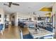 Well-lit dining space with rustic tables and blue chairs near buffet area, ideal for meals at 7100 Ocean Blvd. N # 1425, Myrtle Beach, SC 29572