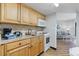 Well-equipped kitchen with cabinets, appliances, and access to the living room at 7100 Ocean Blvd. N # 1425, Myrtle Beach, SC 29572