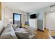 Comfortable living room area with sofa and balcony access to ocean view at 7100 Ocean Blvd. N # 1425, Myrtle Beach, SC 29572