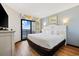 Bright main bedroom featuring a king-size bed, balcony access, and coastal decor for a relaxing vacation at 7100 Ocean Blvd. N # 1425, Myrtle Beach, SC 29572