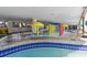 A colorful, shallow water park area for young children with spraying umbrellas and various water features at 7100 Ocean Blvd. N # 1425, Myrtle Beach, SC 29572