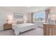 Serene bedroom with neutral tones, natural light, and cozy furnishings at 719 Chazen Way, Longs, SC 29568
