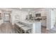 Bright kitchen features a large center island with seating and modern stainless steel appliances at 719 Chazen Way, Longs, SC 29568