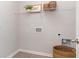 Practical laundry room featuring tile floors, a storage shelf, and washer hookups at 719 Chazen Way, Longs, SC 29568