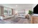 Cozy living room offers a view of the outdoors and stylish decor at 719 Chazen Way, Longs, SC 29568