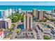 A full aerial view of a condo building, pool, parking lot, ocean, beach, and neighborhood views at 7509 N Ocean Blvd. # 101, Myrtle Beach, SC 29572