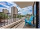 Balcony overlooking a street with tall buildings and palm trees at 7509 N Ocean Blvd. # 101, Myrtle Beach, SC 29572