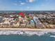 An aerial view of the oceanfront with a condo building a block from the beach at 7509 N Ocean Blvd. # 101, Myrtle Beach, SC 29572