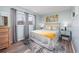 Light and airy bedroom featuring a comfortable bed and coordinated decor with two windows at 7509 N Ocean Blvd. # 101, Myrtle Beach, SC 29572