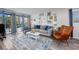 Living room featuring comfortable seating, stylish decor, and sliding glass doors to let in natural light at 7509 N Ocean Blvd. # 101, Myrtle Beach, SC 29572