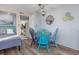 Combination living and dining area offering a cozy space for relaxing and enjoying the ocean view at 7509 N Ocean Blvd. # 101, Myrtle Beach, SC 29572