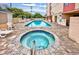 An outdoor pool and hot tub with lounge chairs and patio, with access to the building at 7509 N Ocean Blvd. # 101, Myrtle Beach, SC 29572