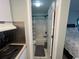Bathroom view showcasing standing shower with tile floors with a stove top in the foreground at 804 12Th Ave. S # 218, North Myrtle Beach, SC 29582