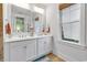 Bathroom featuring a window and double sink vanity providing lots of natural light at 820 Madiera Dr. # 14, North Myrtle Beach, SC 29582